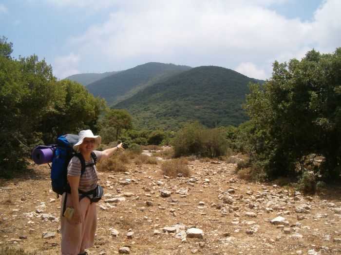 Diana pointing at the top of Mount Meron